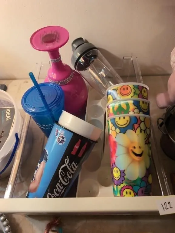 Misc cups and egg tray in fridge drawer