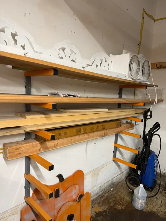 Wall-Mounted Lumber Storage Racks & Assorted Lumber