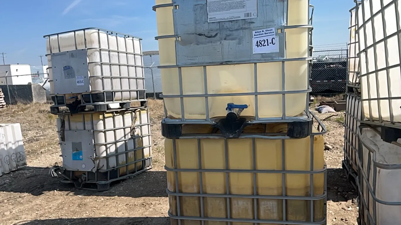 2 - 1000 L POLY TOTE IN METAL CAGE NOT POTABLE