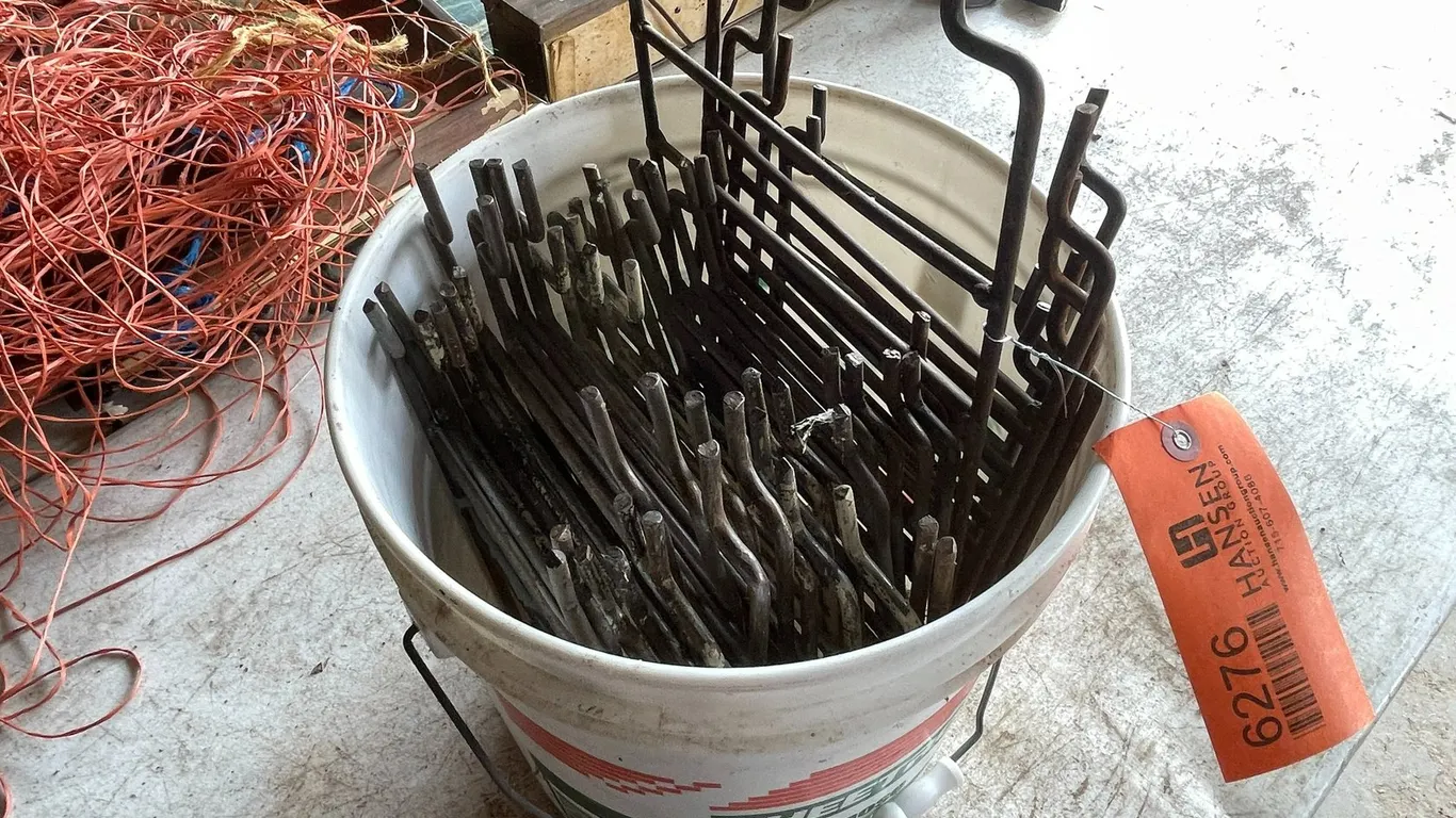 Pail of Conibear Trap Stakes