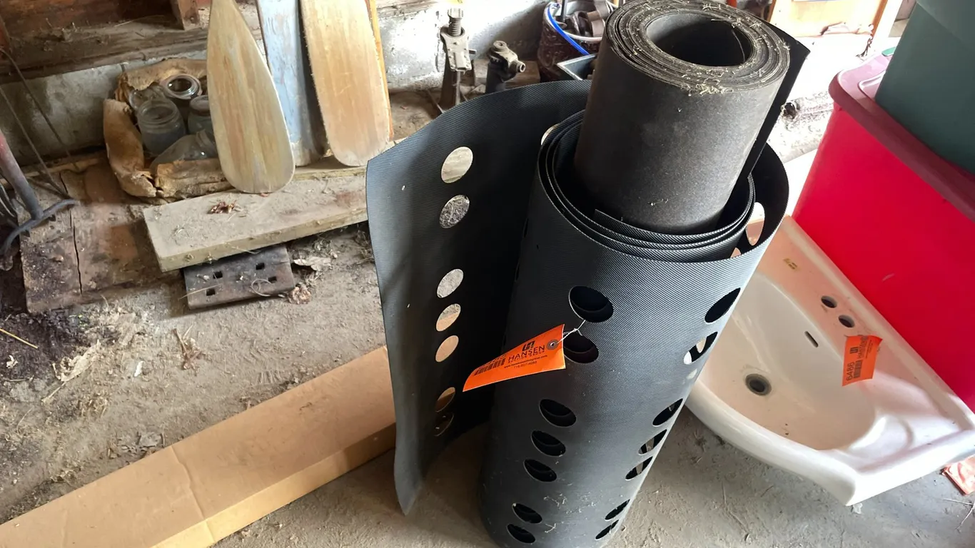 Roll of Tar Paper and Roll of Hard Plastic Composting Material
