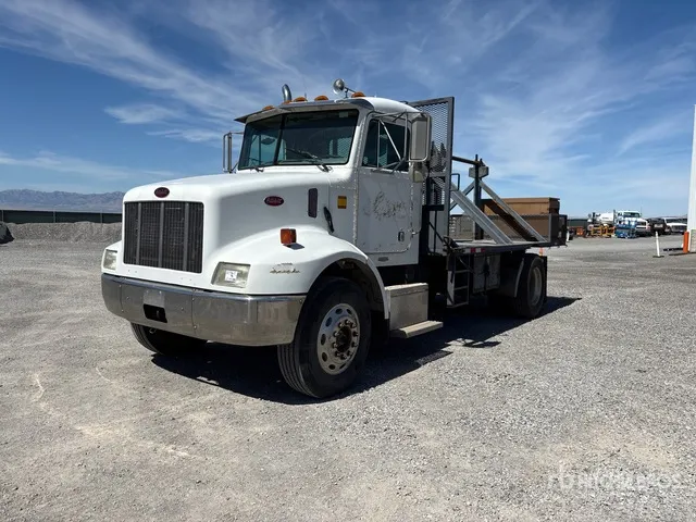 1997 Peterbilt 330 4x2 Flat bed single axle truck with reel holders and take off job box Flatbed Truck