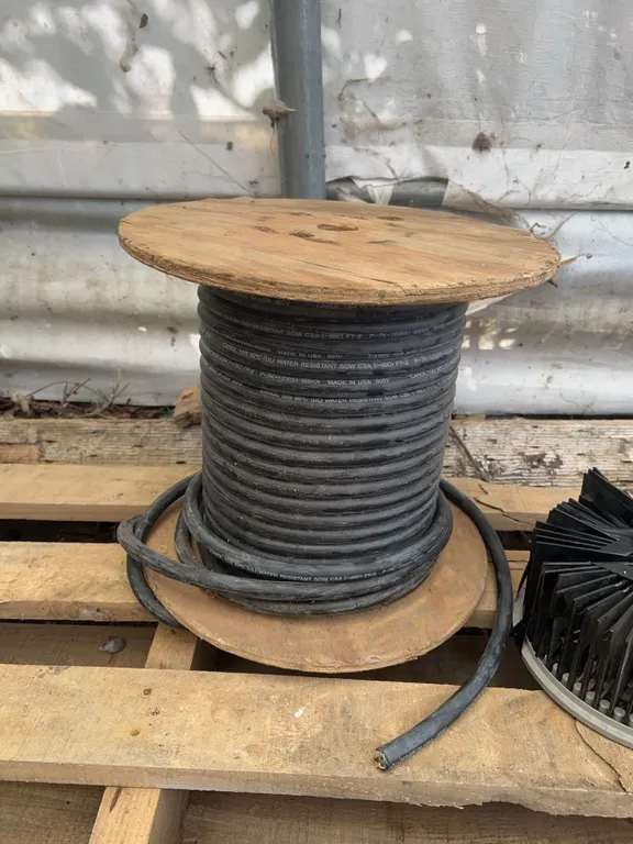 Spool of Carol 12/3 600V SOW Cable and Chimney Cleaning Brush