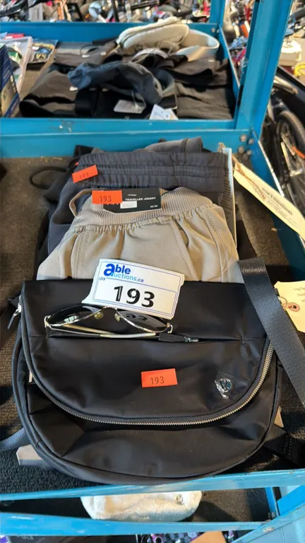 ASSORTMENT OF ATHLETIC BAG AND CASUAL TRAVEL APPAREL ITEMS MIXED SIZES