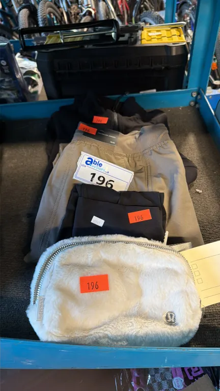 ASSORTMENT OF ATHLETIC BAG AND CASUAL TRAVEL APPAREL ITEMS MIXED SIZES