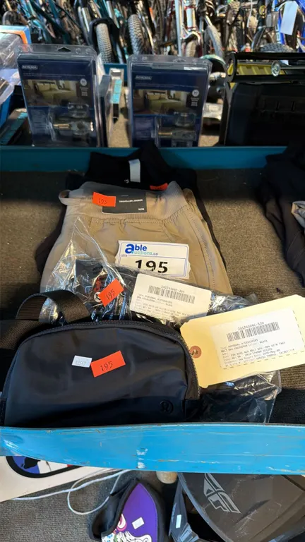 ASSORTMENT OF ATHLETIC BAG AND CASUAL TRAVEL APPAREL ITEMS MIXED SIZES