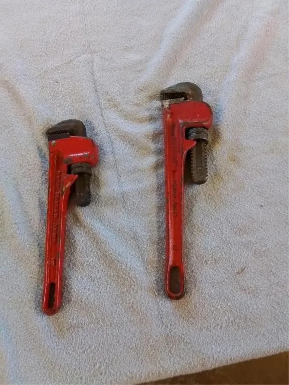 2 pipe wrenches. 10" and 12"