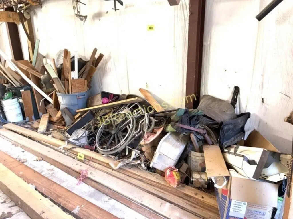 WOOD AND SCRAP PILE IN CENTER GARAGE