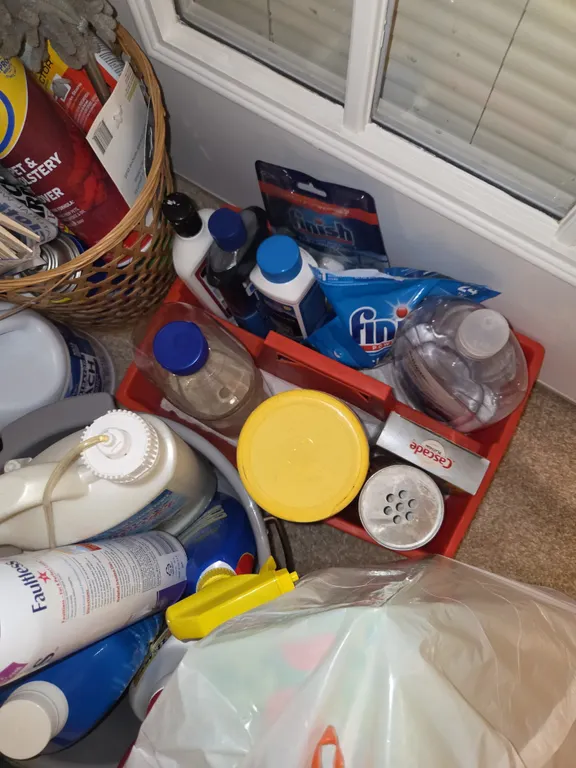Ironing board and cleaning supplies
