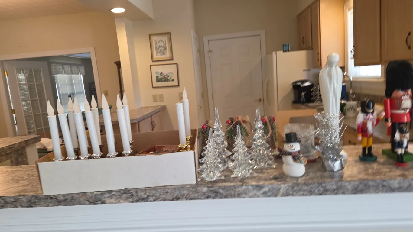 Christmas items, including nutcrackers, glass trees, candles, and more