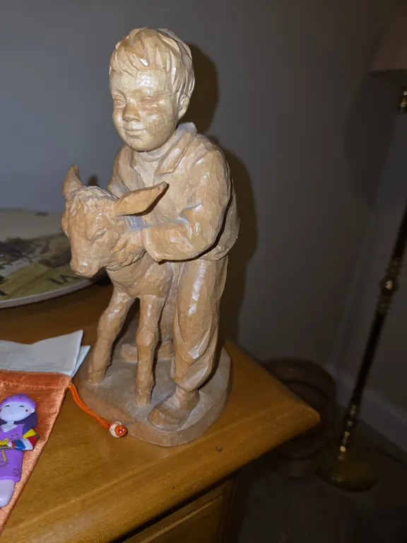 Boy with a sheep statue