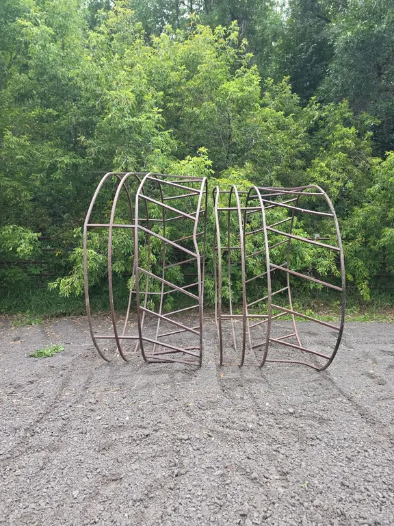 2 steel round bale feeders