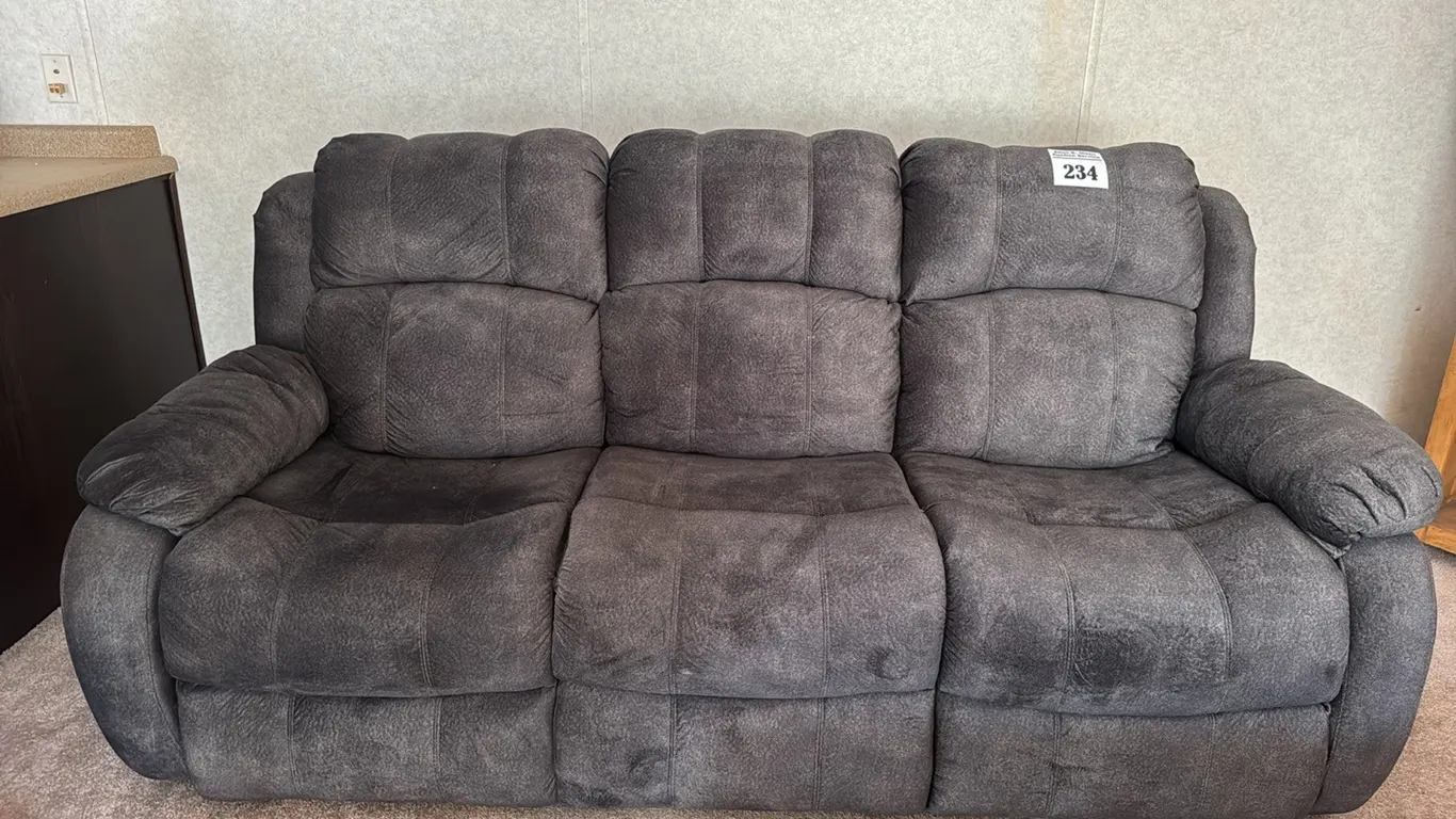 CHARCOAL COLORED RECLINER COUCH