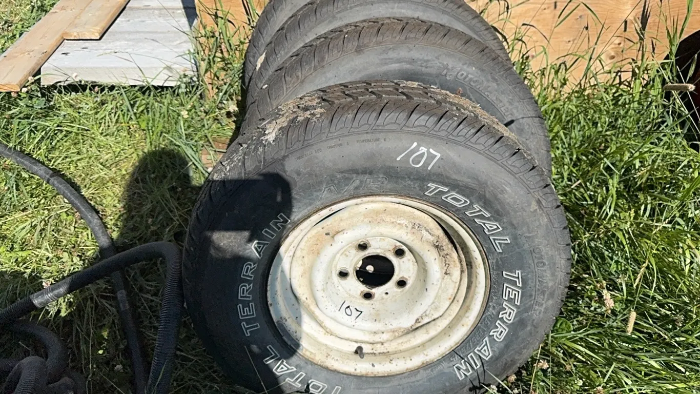 4 - MUD & SNOW 235/75R15 TIRES ON 5 HOLE RIMS - TIRES ARE NEXT TO NEW