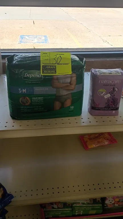 Assorted retail shelf contents. Lot includes personal care products (Depend underwear, Natracare pads), Healthy Choice canned soup, toothpicks, salad