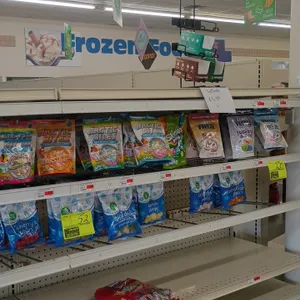 Assorted candy and snack inventory from a 12' section. Includes packaged candies, confections, beef jerky, and liquid drink enhancers. Shelving unit n