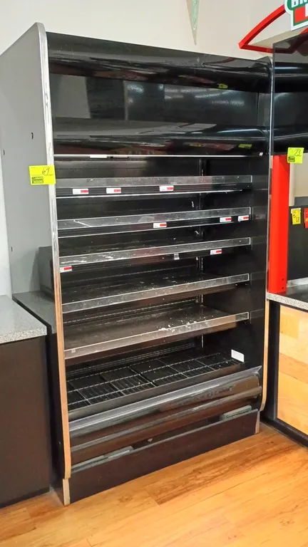 Hussmann RGD-4-SC self-contained multi-deck open display merchandiser. Features multi-tier adjustable shelving with price tag molding, lower wire deck