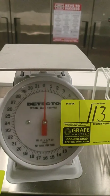 Detecto PT-2 mechanical portion control scale. Features a 32 oz capacity with 1/4 oz graduations and a stainless steel weighing platform.