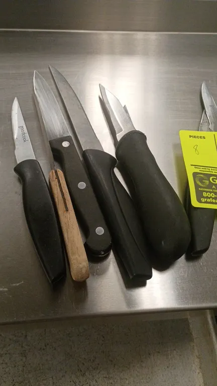 GoodCook assorted kitchen knives. Features assorted blade styles and lengths with composite and wood handles.