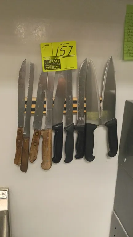 Assorted commercial kitchen knives and magnetic wall strip. Includes (9) assorted knives with stainless steel blades, featuring wood and molded compos