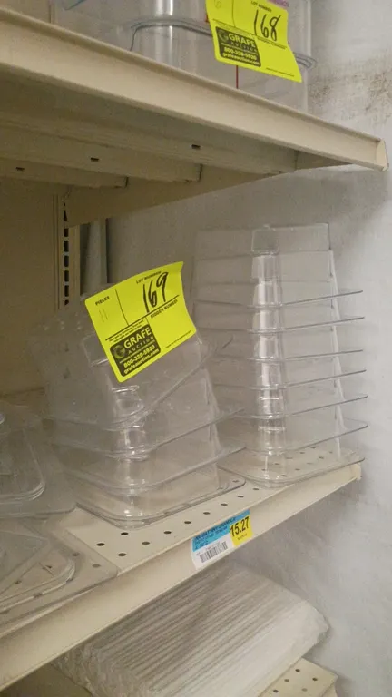 Cambro 1/6 size polycarbonate food pan strainers with lids. Features clear polycarbonate construction with perforated strainer bottoms and handled fla