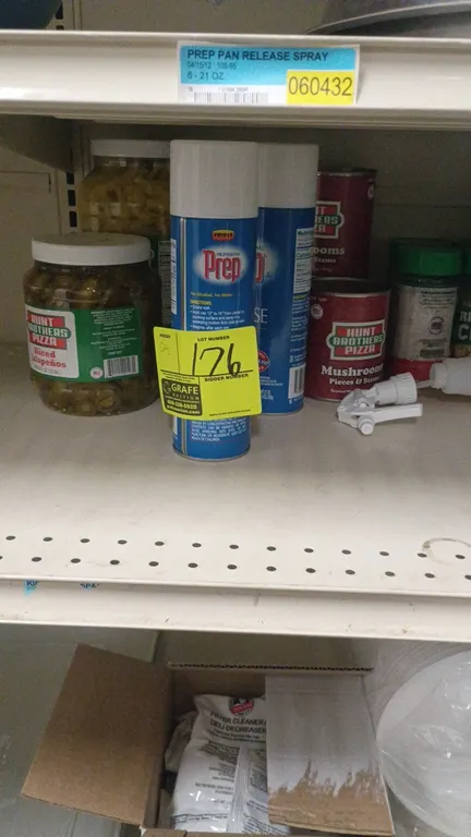 Assorted kitchen and restaurant supplies. Includes seasonings, jarred sliced jalapeños, canned mushrooms, Prep pan release spray, spray bottles, Han-D