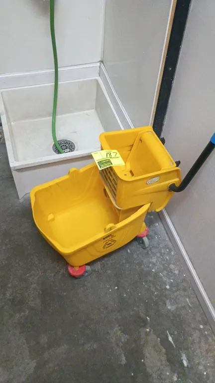 Lavex mobile mop bucket with wringer. Features yellow molded plastic construction and wringer handle with grip. Mounted on swivel casters.