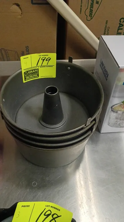 Angel food cake tube pans. Features two-piece construction with removable center cone bottom and integrated cooling feet.
