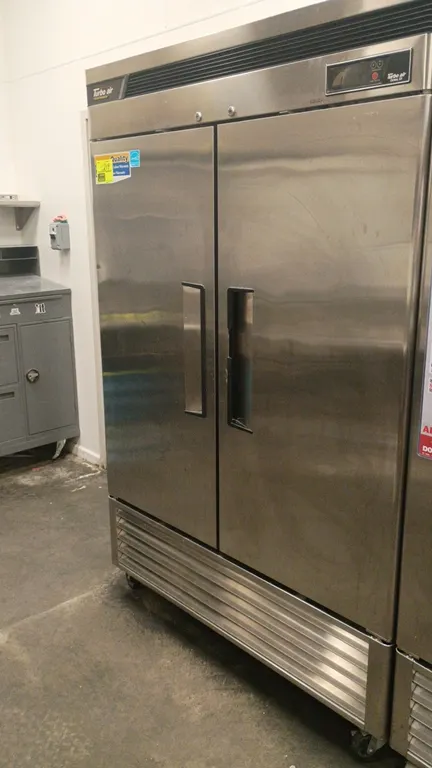 Turbo Air TSR-49SD Deluxe 2-door reach-in refrigerator. Features stainless steel construction, solid doors, adjustable wire shelving, and digital temp