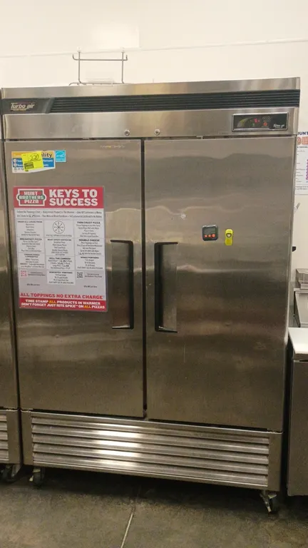 Turbo Air TSF-49SD Deluxe reach-in freezer. Features stainless steel 2-door construction, adjustable wire shelving, digital temperature display, and s