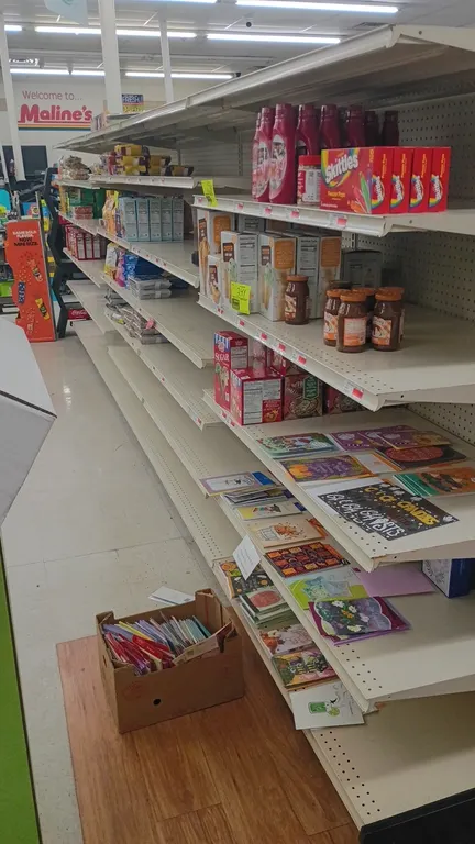 20'L of Lozier wall shelving. Features 72"H uprights, 22"D base shelves, adjustable upper shelves, and pegboard backing. Contents not included.