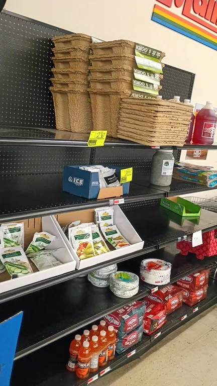 8'L of Lozier wall shelving. Features black metal construction, pegboard backing, 72"H uprights, 30"D base shelves, and adjustable upper shelves. Cont