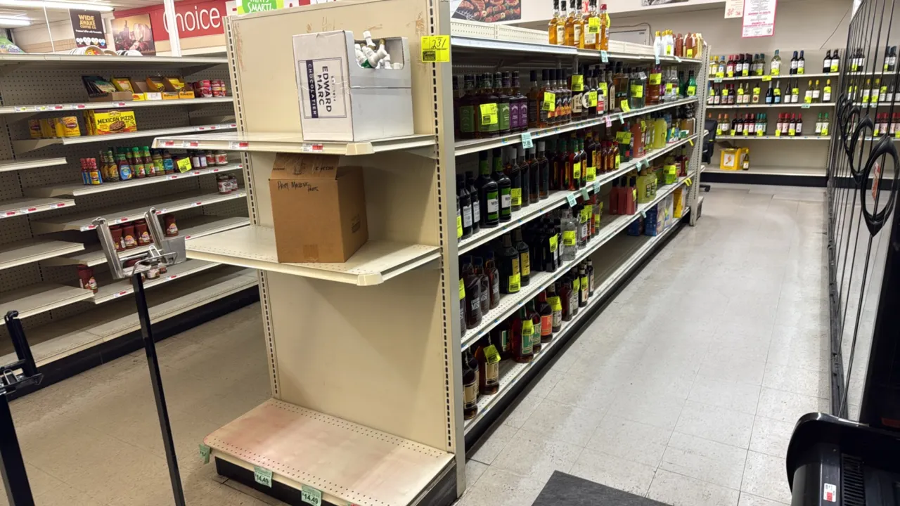 38'L of Lozier double-sided gondola shelving. Features 72"H uprights, 16" base shelves, adjustable upper shelves, and end caps. Off-white metal constr