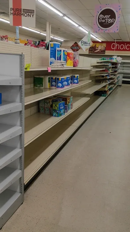 96'L of Lozier gondola shelving. 72"H uprights with 22" base shelves. Features pegboard backing and adjustable metal shelving. Contents not included.