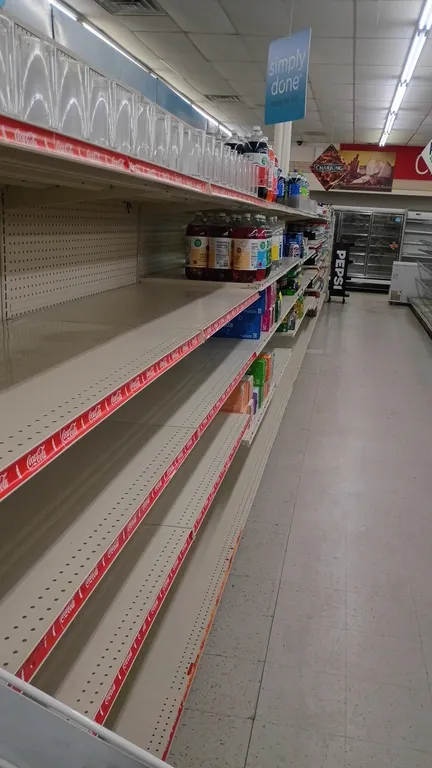 56'L of Lozier gondola shelving. Features 84"H uprights with 22"D base shelves and adjustable upper shelves with pegboard backing. Contents not includ