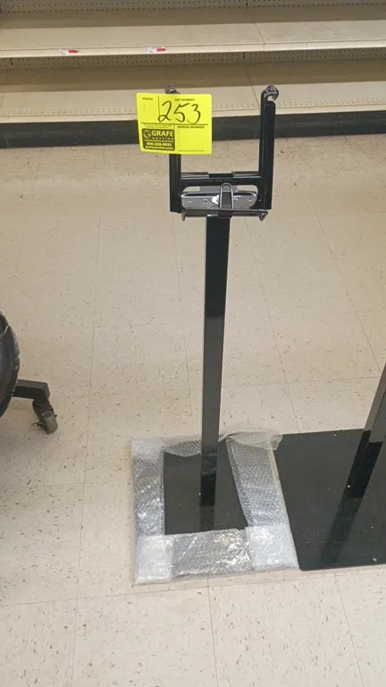 Produce bag stands. Features steel upright construction with roll bag dispensers. Mounted on flat square base plates.