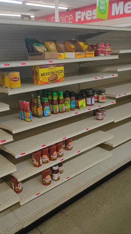 Contents of 4' shelving section. Includes assorted salsas, hot sauces, taco sauces, Old El Paso Mexican pizza kit, Dynasty baby corn, seasoning packet