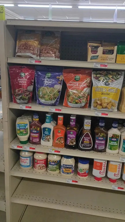 Contents of 4' grocery shelving section. Includes assorted salad dressings, mayonnaise, sauces, croutons, and seasoning mixes. Featuring brands such a