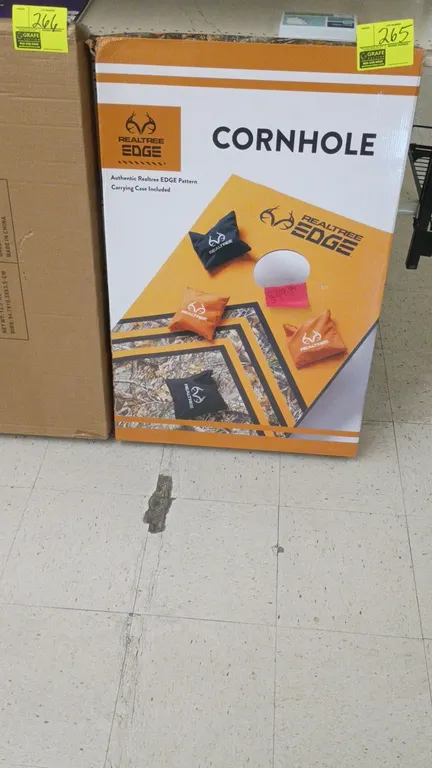 Realtree EDGE cornhole game set. Features authentic Realtree EDGE camo graphics. Includes bean bags and carrying case. In original retail box.