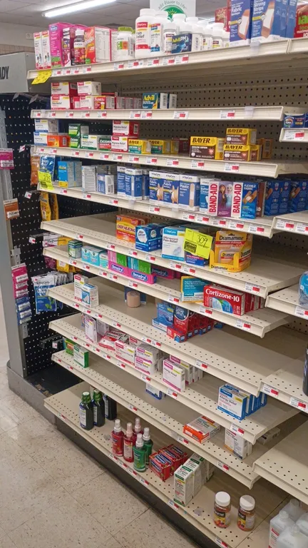 Contents of 4' shelving section of assorted over-the-counter medication and first aid supplies. Includes pain relief, allergy medicine, bandages, and