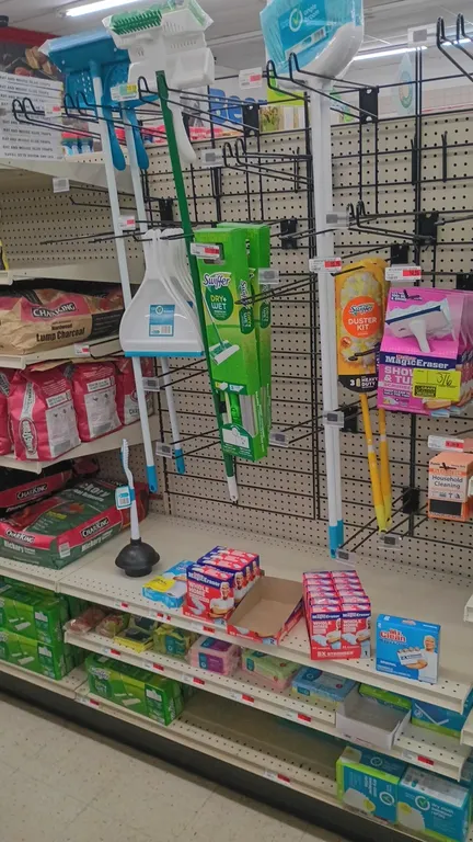 Assorted cleaning supplies inventory from 4' gondola section. Includes Mr. Clean Magic Erasers, Swiffer Sweeper starter kits, Swiffer duster kit, angl