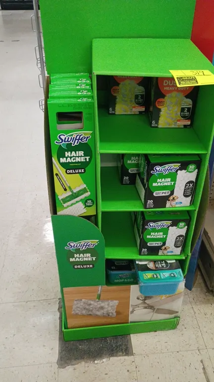 Swiffer Hair Magnet retail cardboard display stand with assorted cleaning products. Includes Swiffer Hair Magnet Deluxe sweeping kits, Heavy Duty dust