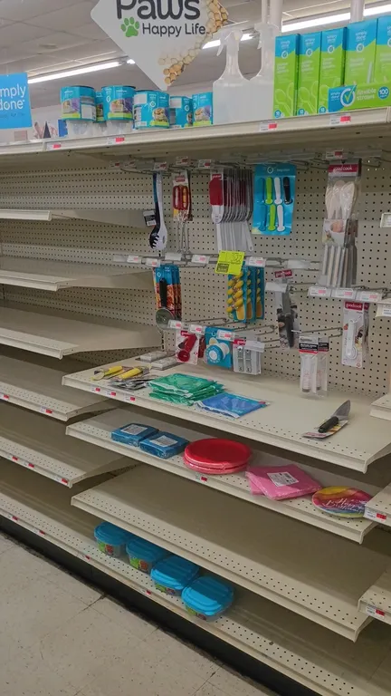 Contents of 4' section. Includes kitchen utensils, food storage containers, disposable plastic spoons, straws, spray bottles, paper plates, napkins, a