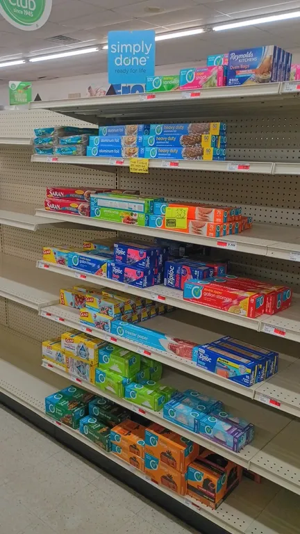 Contents of 4' shelving section. Includes trash bags, sandwich and food storage bags, freezer bags, plastic wrap, aluminum foil, and freezer paper. Fe