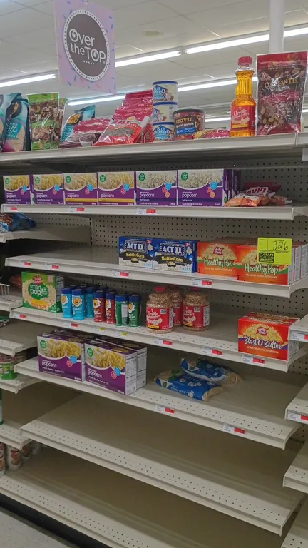 Contents of 4' shelving section. Includes assorted microwave popcorn, popping corn kernels, popping oil, popcorn seasonings, sunflower seeds, peanuts,