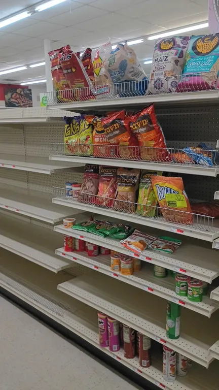 Contents of 4' shelving section. Assorted chips, pretzels, dips, and snacks. Includes brands such as Pringles, Crav'n Flavor, Takis, Bugles, Siete, La