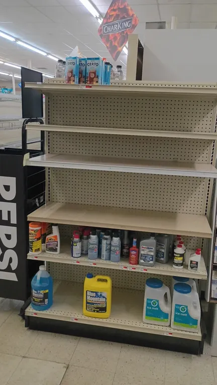 Contents of 4' shelving section. Includes antifreeze, ice melt, motor oil, WD-40, windshield spray de-icer, windshield wash, gas treatment, brake flui