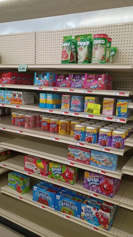 Assorted drink mix and beverage inventory from 4' shelving section. Includes powdered drink mixes, liquid water enhancers, and juice pouches from bran