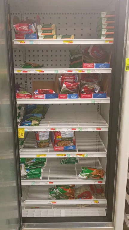 Assorted frozen food contents from 5 freezer display doors. Inventory includes packaged frozen vegetables, french fries, frozen entrees, and side dish