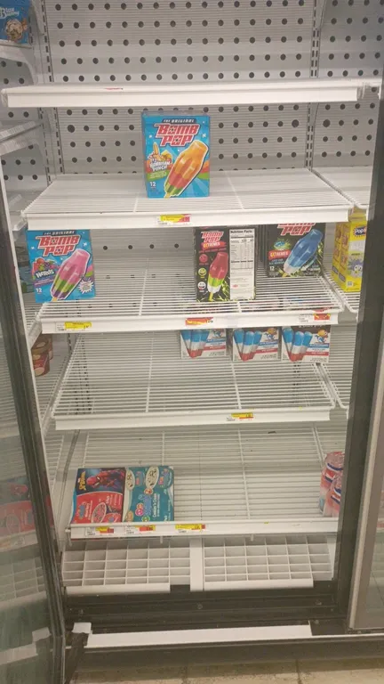 Assorted frozen grocery contents from 5 freezer doors. Includes novelty ice pops, ice cream treats, frozen fruit, whipped toppings, pie crusts, frozen